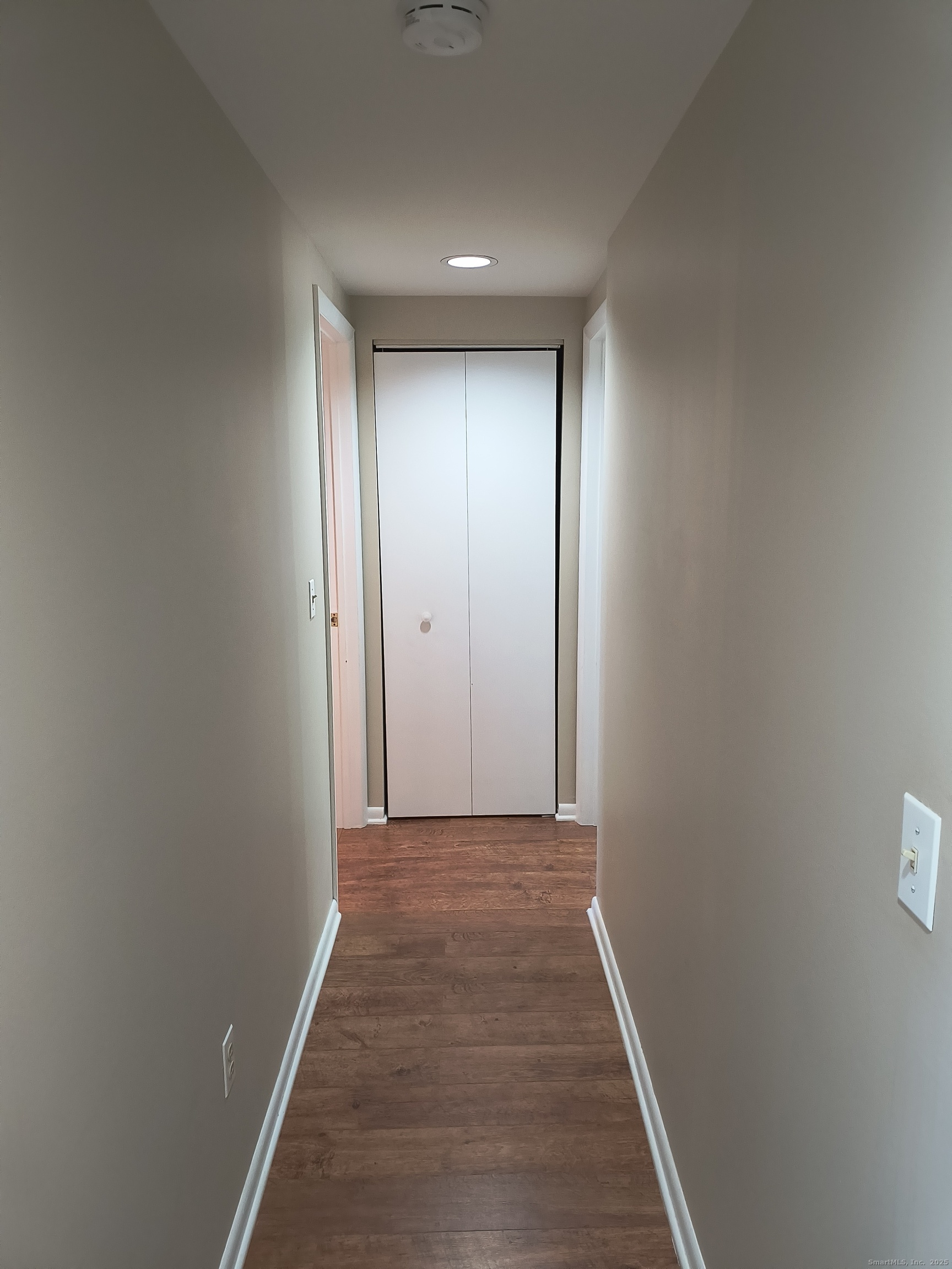 532 Popes Island Road, Unit 532 Milford, CT 06461 - Photo 16 of 23 a view of hallway with wooden floor