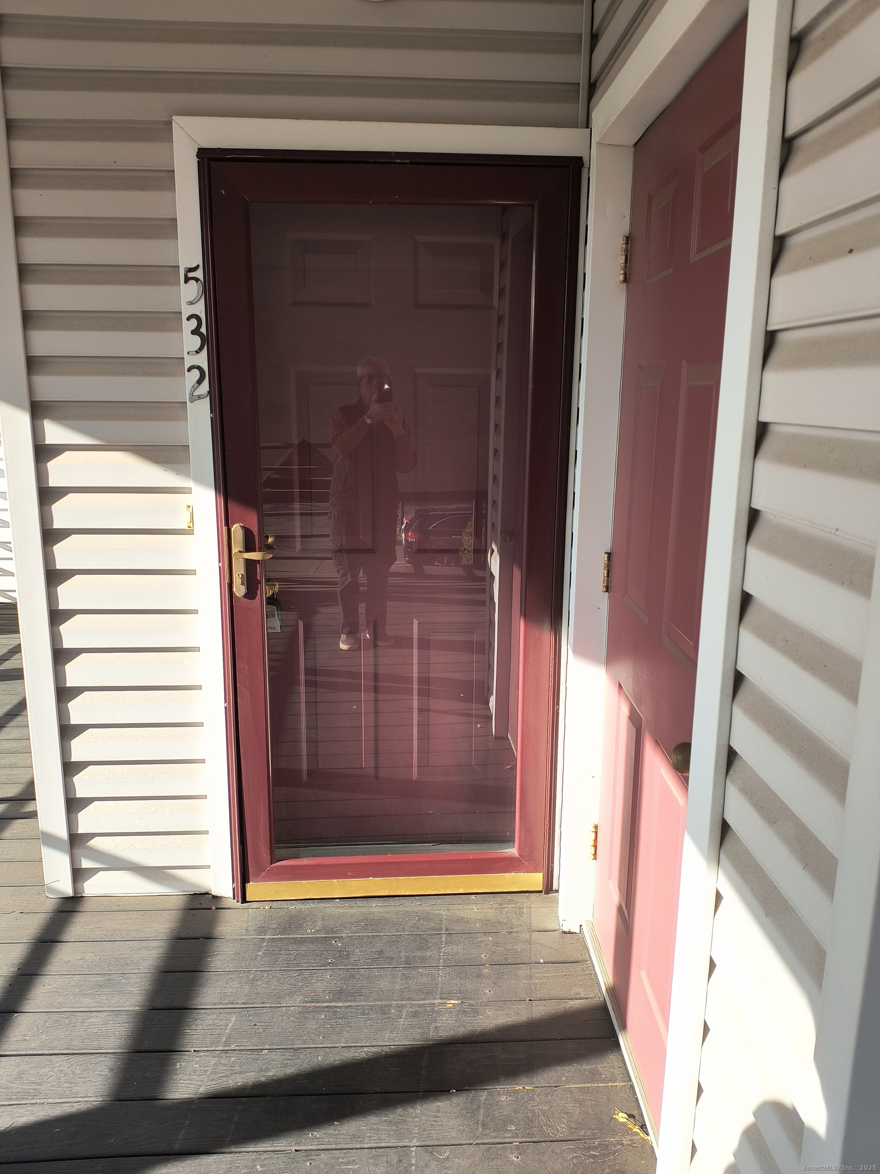 532 Popes Island Road, Unit 532 Milford, CT 06461 - Photo 3 of 23 a view of a wooden door of the house