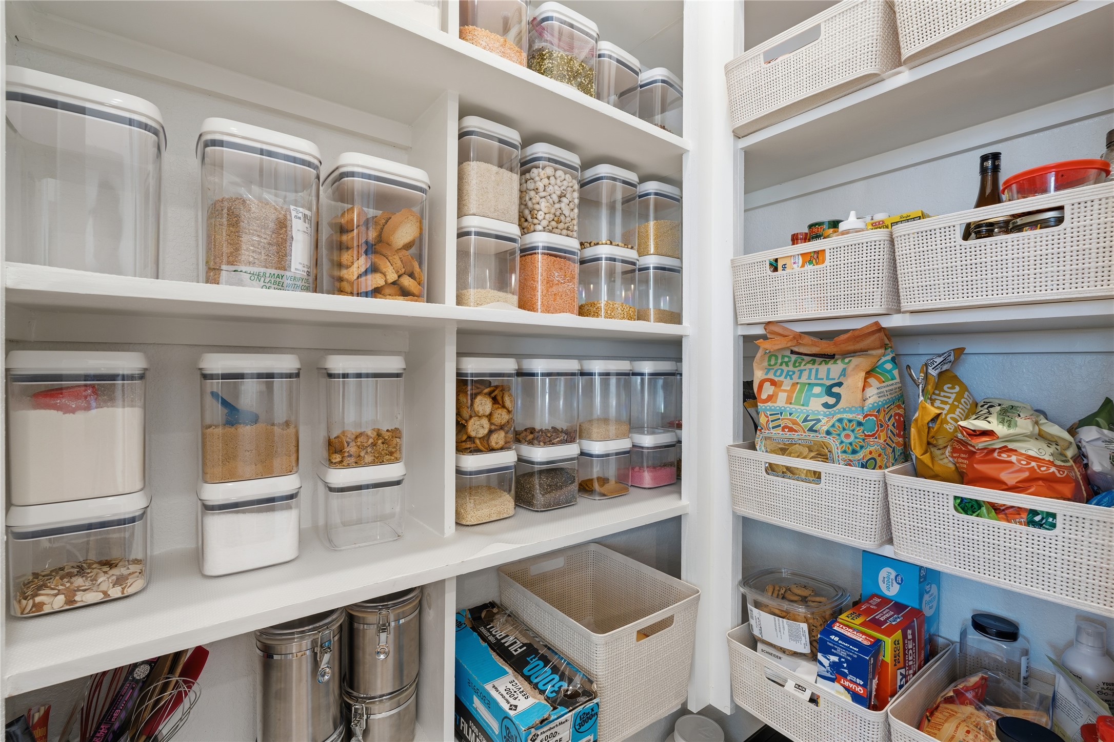 416 Bartlett Street Webster, TX 77598 - Photo 10 of 49 Massive walk-in pantry with floor-to-ceiling built-in shelving