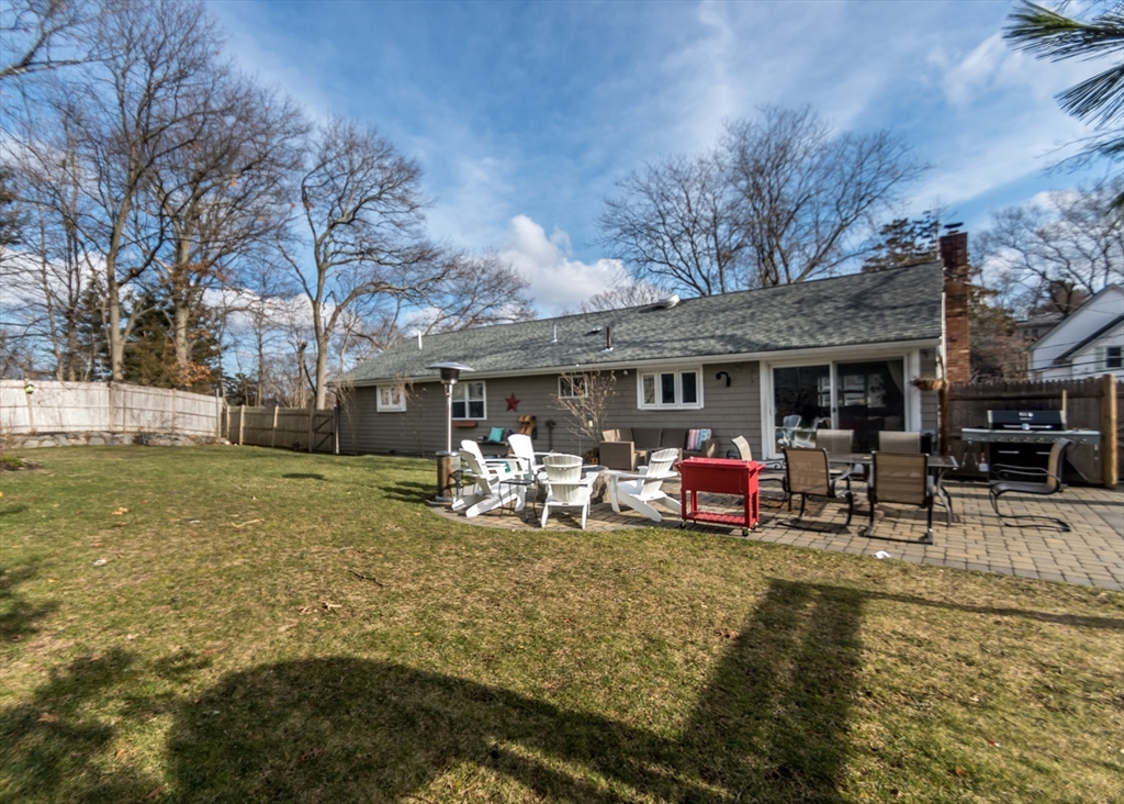 27 Sherman Street Needham, MA 02494 - Photo 27 of 32 a view of a house with backyard porch and sitting area