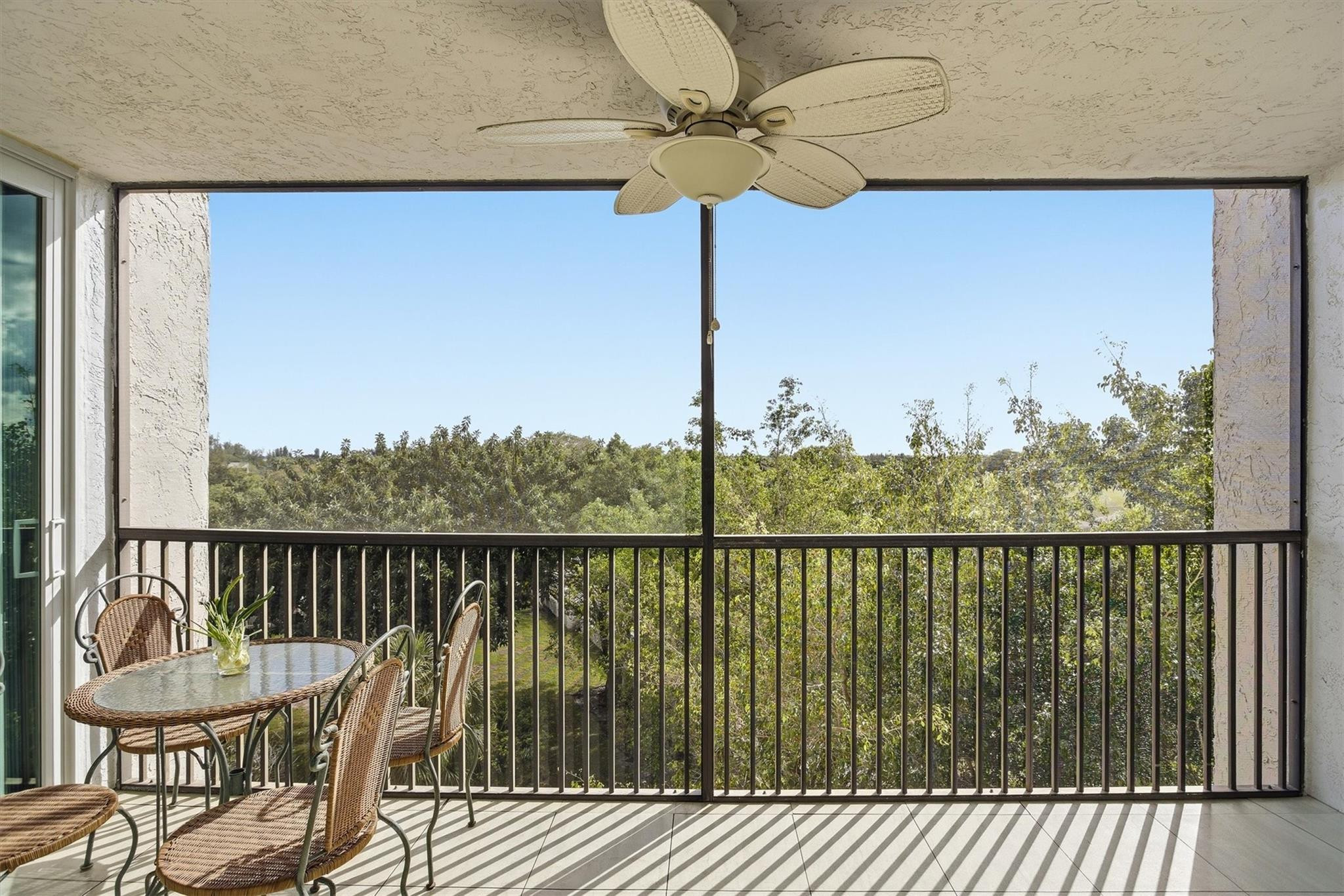 3910 Inverrary Boulevard, Unit 708B Lauderhill, FL 33319 - Photo 2 of 58 a view of a balcony with lake view and wooden floor