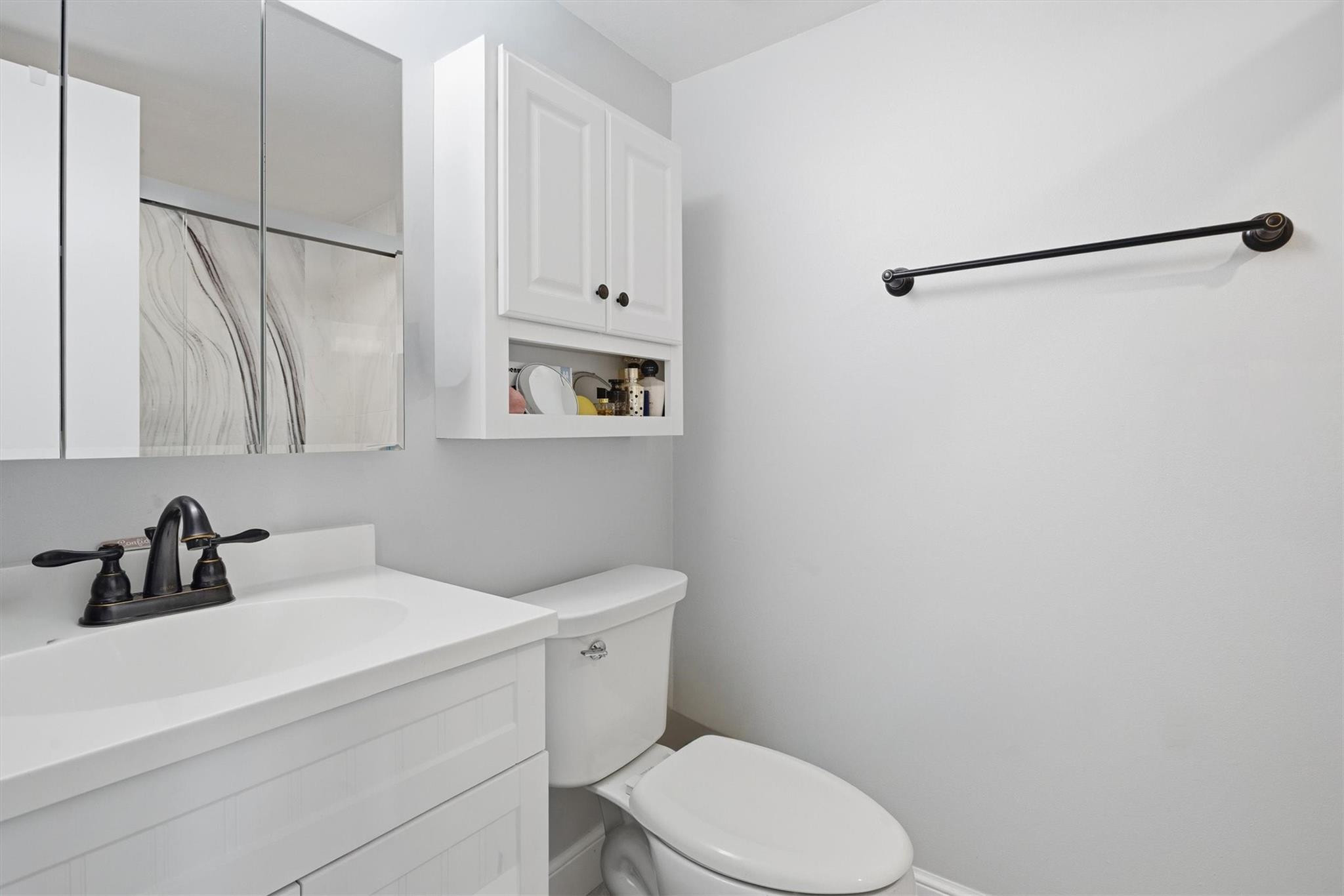 3910 Inverrary Boulevard, Unit 708B Lauderhill, FL 33319 - Photo 23 of 58 a bathroom with a sink a toilet and shower