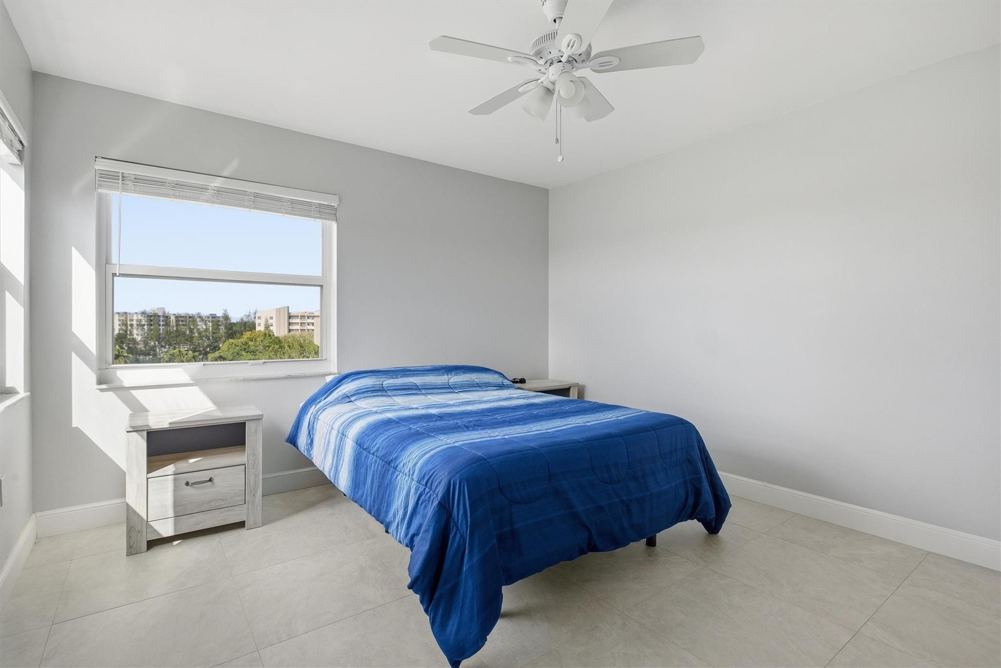 3910 Inverrary Boulevard, Unit 708B Lauderhill, FL 33319 - Photo 26 of 58 a bedroom with a bed and window