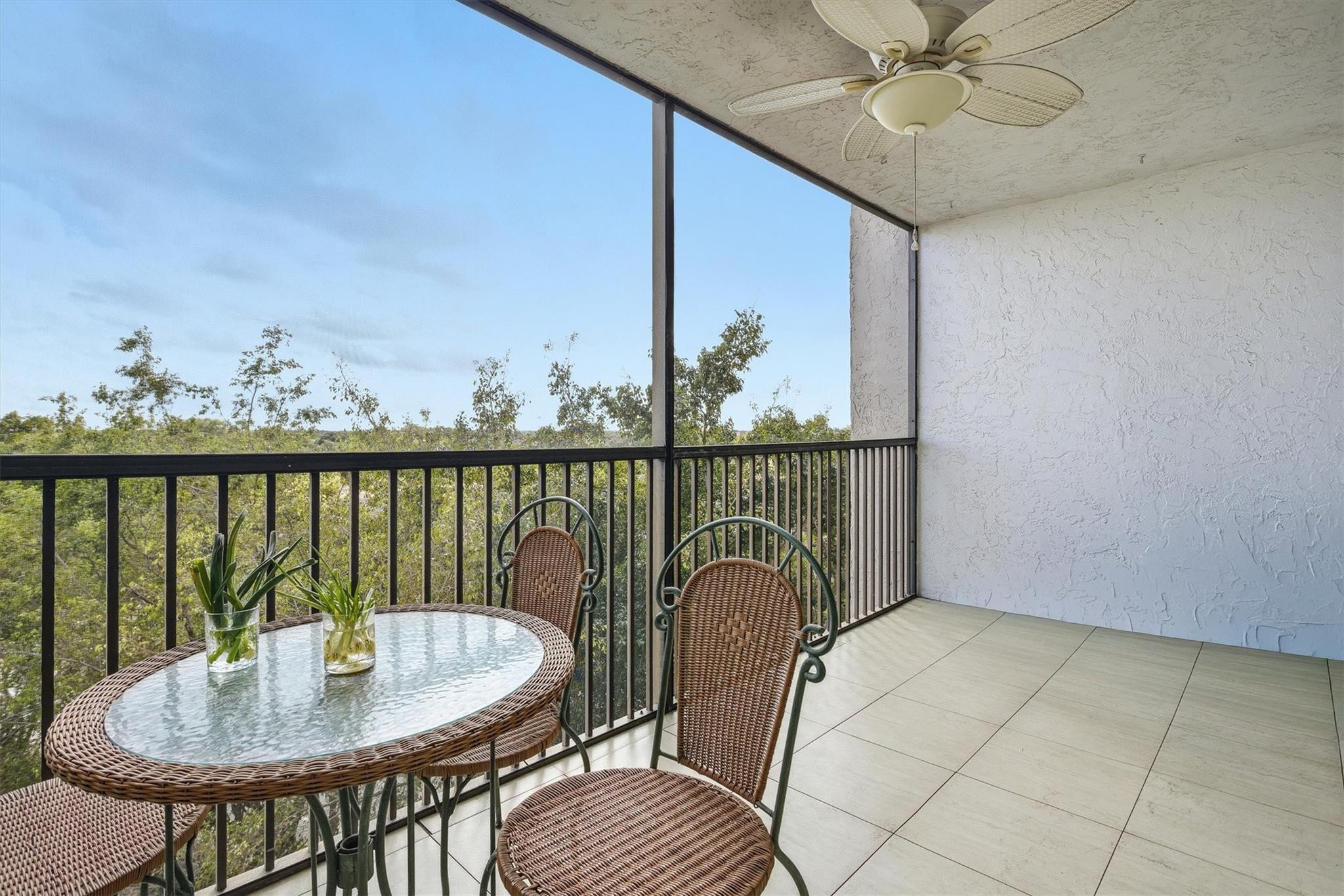 3910 Inverrary Boulevard, Unit 708B Lauderhill, FL 33319 - Photo 3 of 58 a balcony with table and chairs
