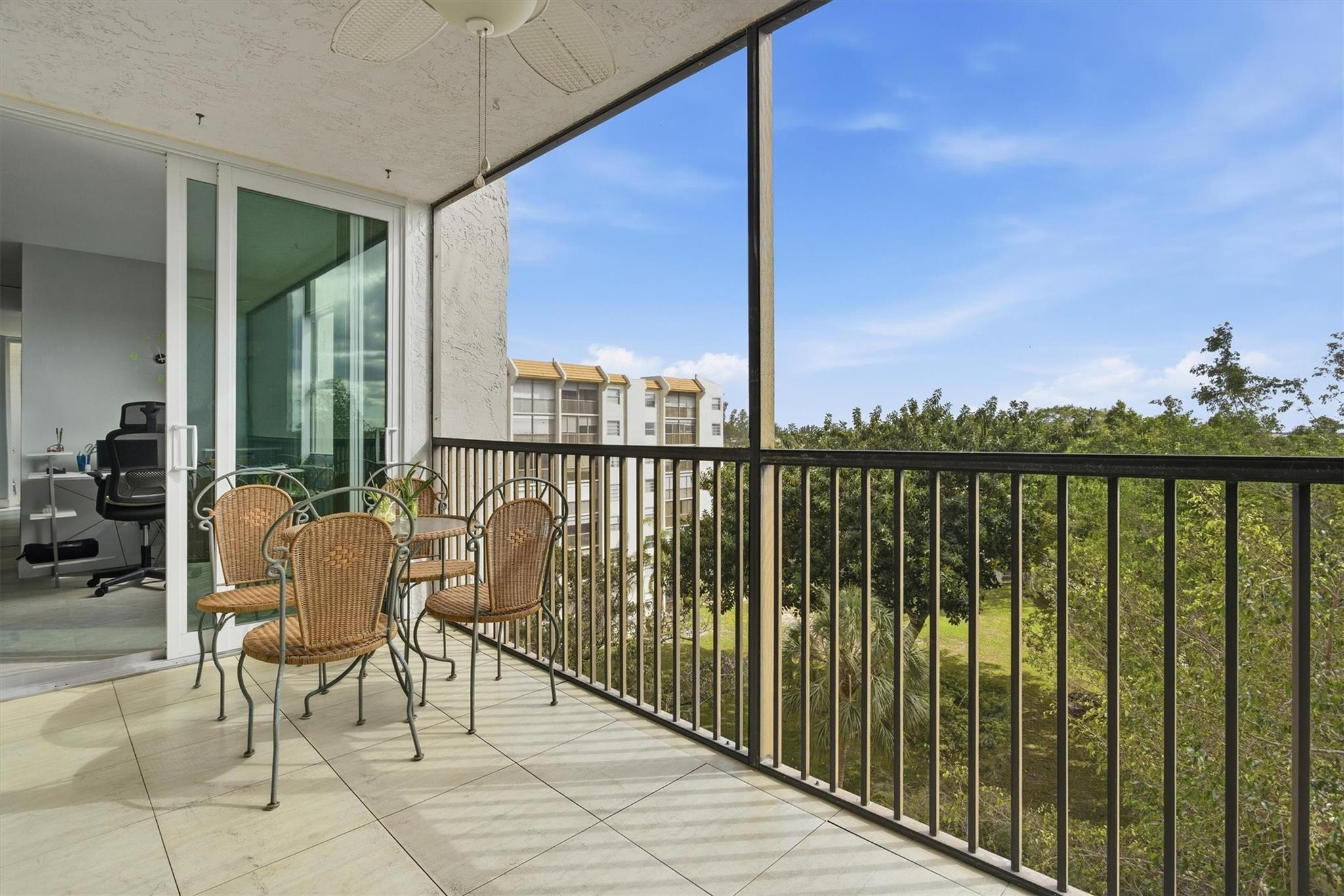 3910 Inverrary Boulevard, Unit 708B Lauderhill, FL 33319 - Photo 4 of 58 a balcony with furniture and city view