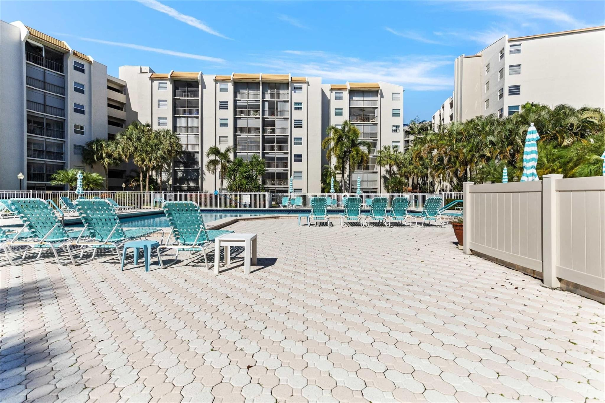 3910 Inverrary Boulevard, Unit 708B Lauderhill, FL 33319 - Photo 51 of 58 a view of a building with backyard and sitting area