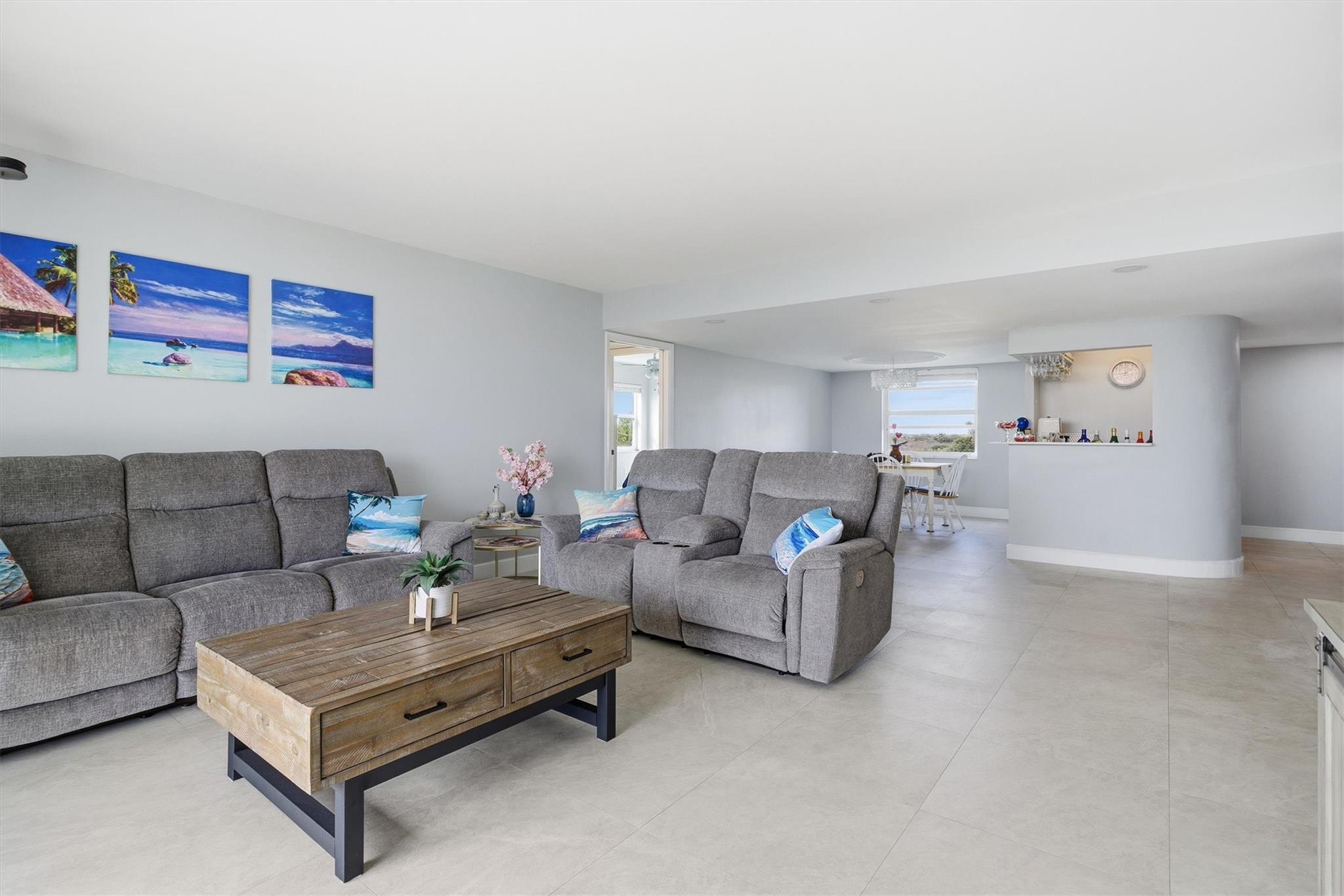 3910 Inverrary Boulevard, Unit 708B Lauderhill, FL 33319 - Photo 8 of 58 a living room with furniture and a couch