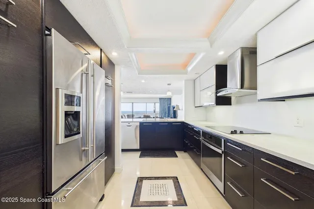 a large kitchen with a large window