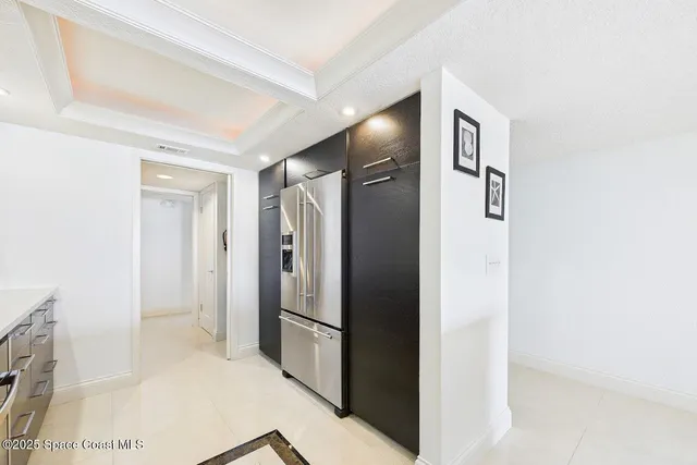 a bathroom with a shower and a glass door