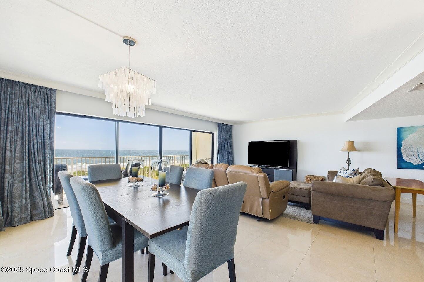 55 North 4th Street, Unit 401 Cocoa Beach, FL 32931 - Photo 10 of 34 a view of a dining room with furniture