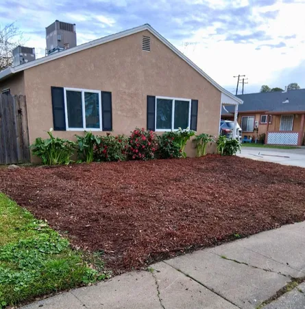 a front view of a house with garden