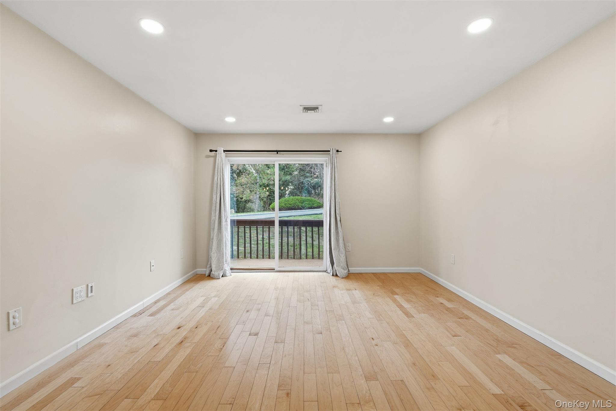 17 Knoll View Ossining, NY 10562 - Photo 11 of 34 a view of an empty room with wooden floor and a window