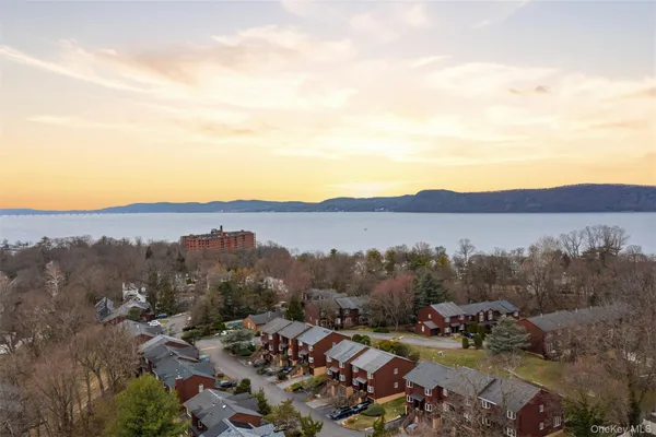 a view of a city with lots of residential buildings and mountain view in back