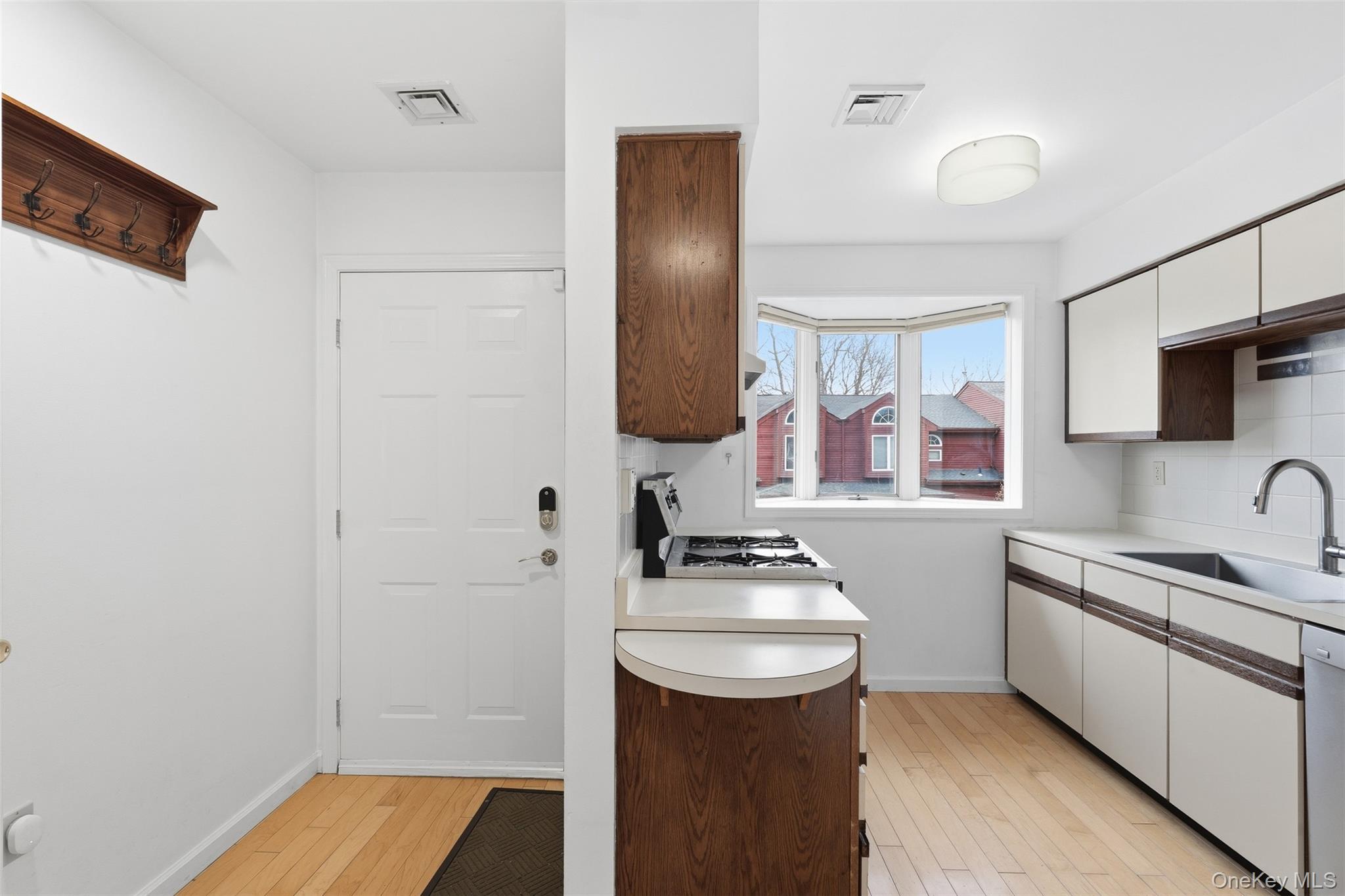 17 Knoll View Ossining, NY 10562 - Photo 6 of 34 a kitchen with a sink and a refrigerator