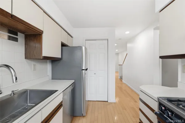 a view of a hallway with a white walls