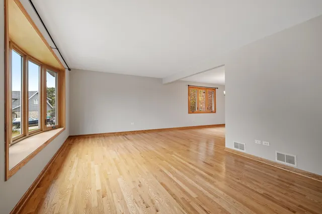 a view of an empty room and glass door