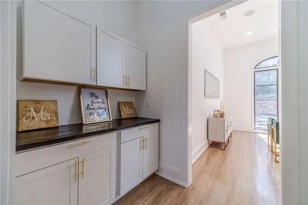 a view of a hallway with chandelier