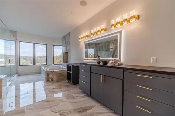 a spacious bedroom with a bed and a large window