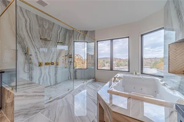a bathroom with a granite countertop sink mirror vanity and toilet