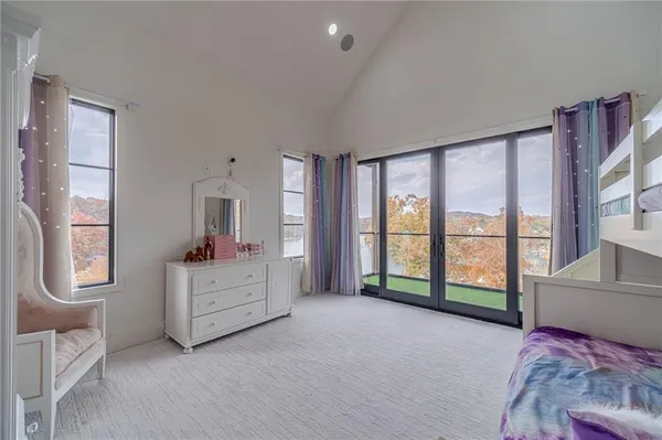 a bathroom with a sink a toilet a mirror and vanity