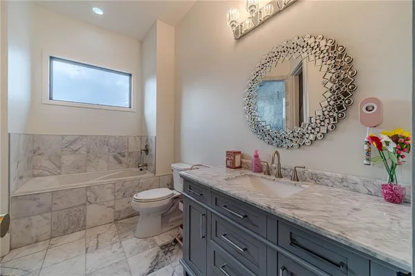 a spacious bedroom with a bed and a window