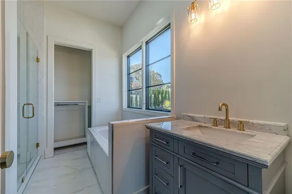 a living room with furniture and a dresser