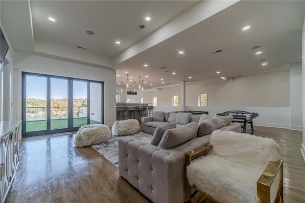 a swimming pool with outdoor seating and yard