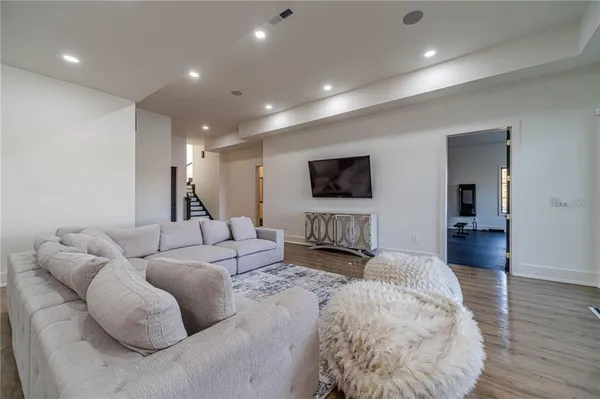 an aerial view of a house with outdoor space and a swimming pool