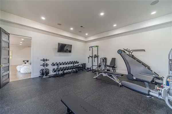 a living room with furniture pool table and chairs