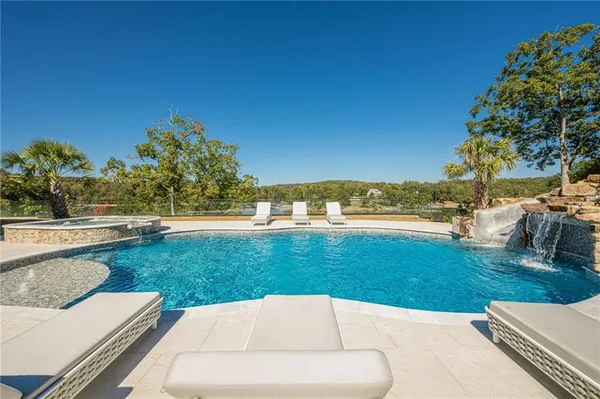 a view of a lake with a car parked