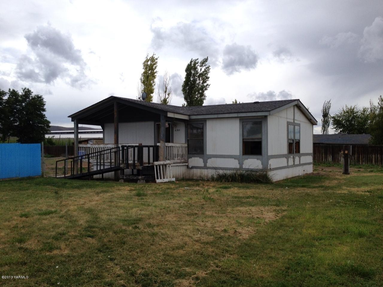 6304 Postma Road Yakima, WA 98901 - Photo 1 of 5 a view of a house with a yard