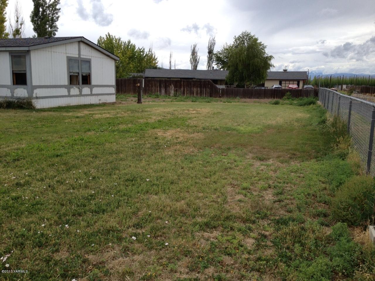 6304 Postma Road Yakima, WA 98901 - Photo 4 of 5 a view of a house with a backyard