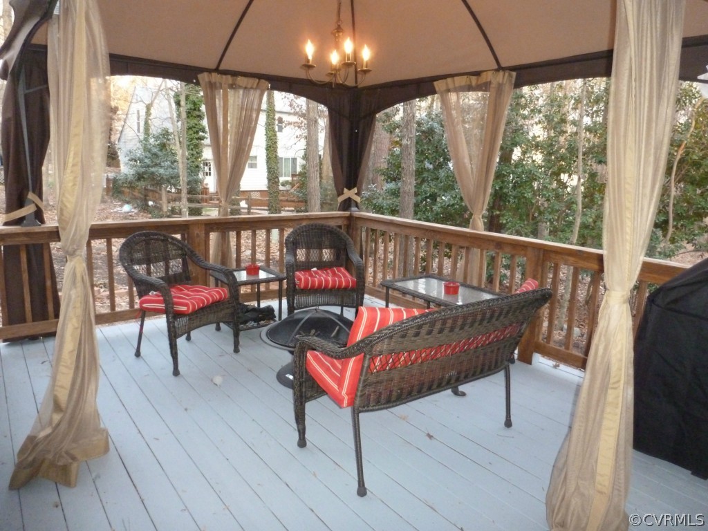 14806 Acorn Ridge Road Midlothian, VA 23112 - Photo 18 of 24 a balcony with wooden floor and outdoor seating