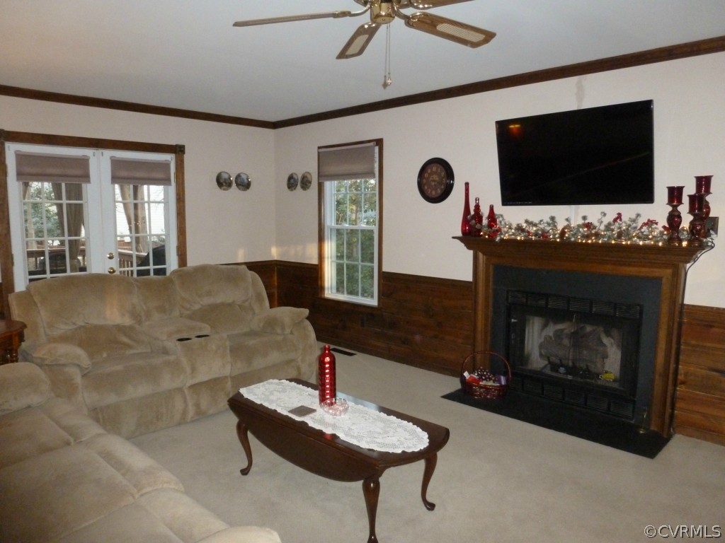 14806 Acorn Ridge Road Midlothian, VA 23112 - Photo 3 of 24 a living room with furniture and a flat screen tv