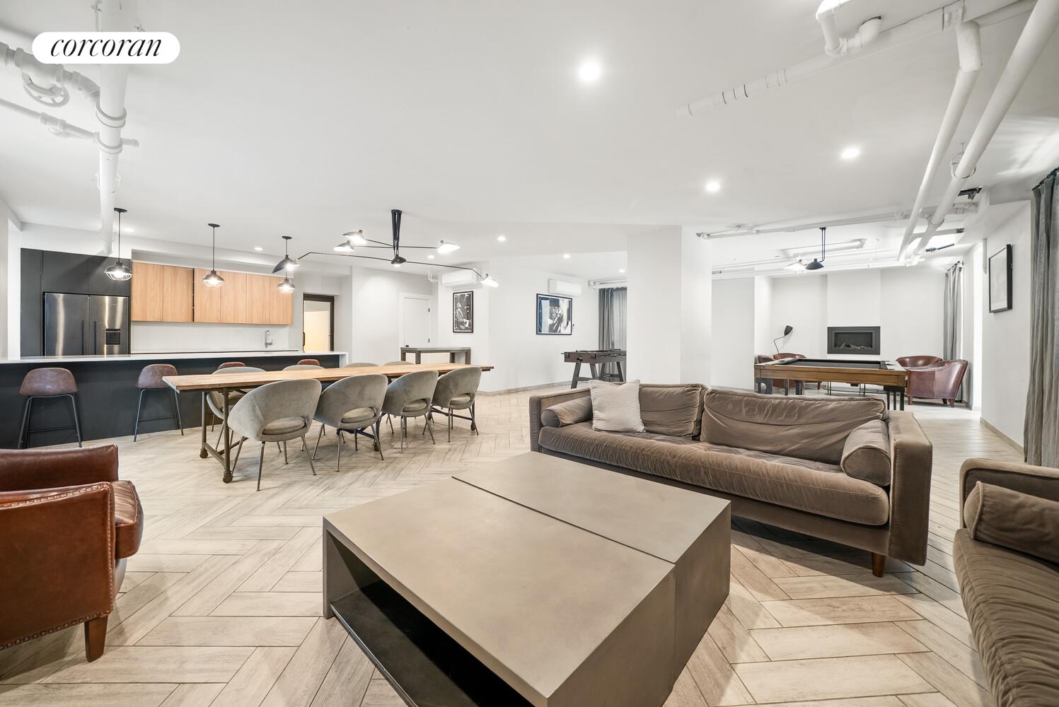 24-51 38th Street, Unit B7 Queens, NY 11103 - Photo 8 of 13 a living room with lots of furniture and kitchen view