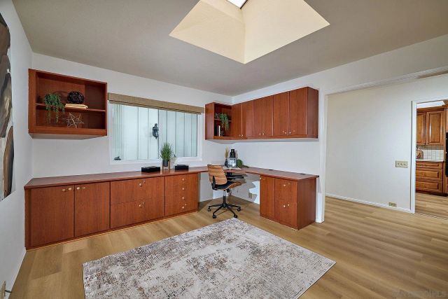 a room with cabinets and wooden floor