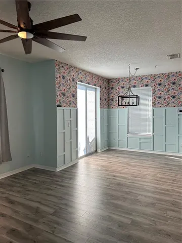 a view of a livingroom with wooden floor