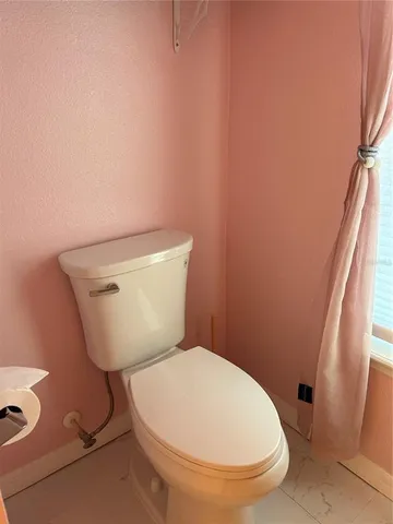 a bathroom with a toilet and a sink
