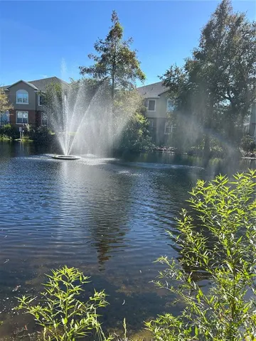 a view of a lake with a building in the background