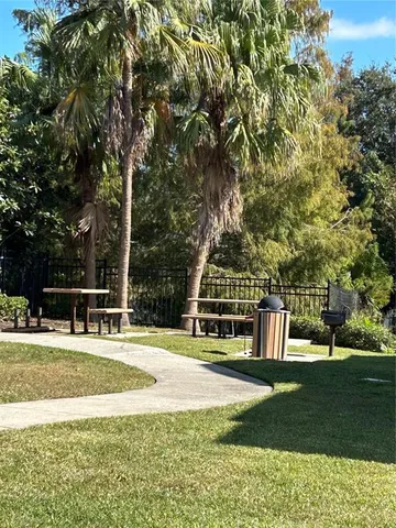 a view of a playground with basketball court