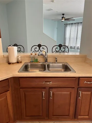 a kitchen with a sink and cabinets
