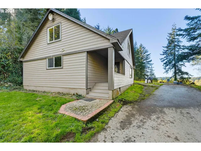 a kitchen with granite countertop a sink stove and cabinets