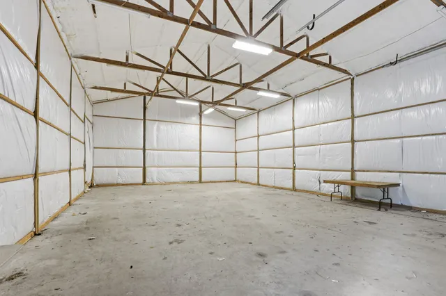 a view of a backyard with swimming pool