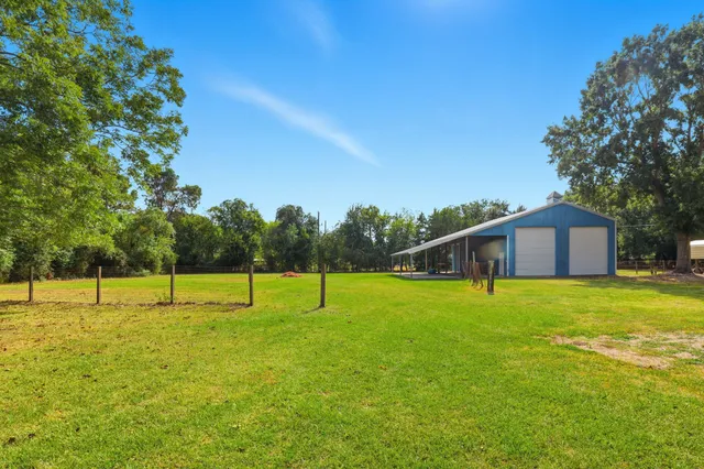 a house with swimming pool in front of it