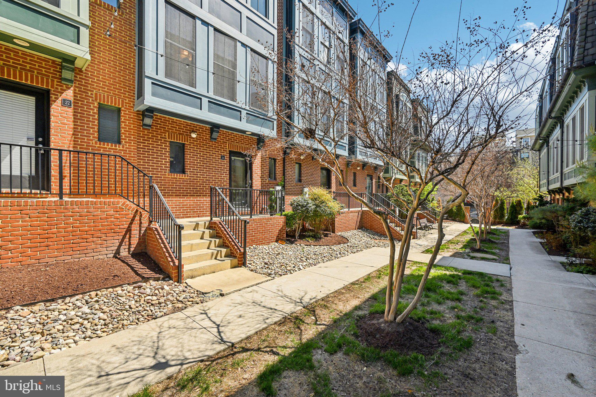 24 South Regester Street Baltimore, MD 21231 - Photo 42 of 44 a view of a building with backyard and sitting area