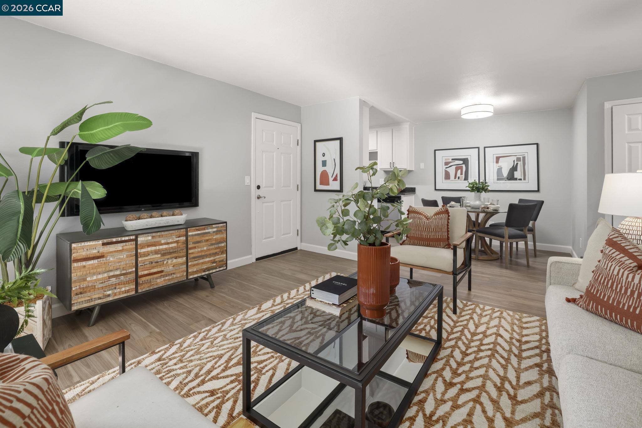 1505 Kirker Pass Road, Unit 164 Concord, CA 94521 - Photo 1 of 29 a living room with furniture and a flat screen tv