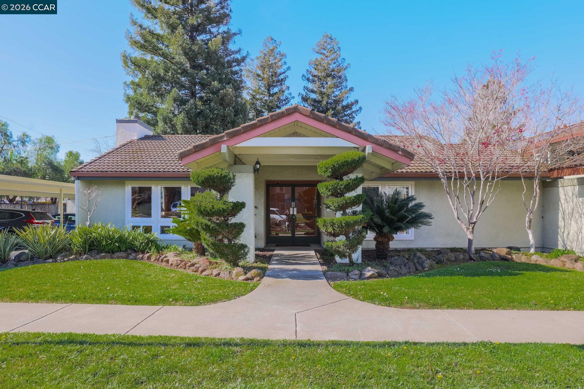 1505 Kirker Pass Road, Unit 164 Concord, CA 94521 - Photo 11 of 29 a front view of a house with garden