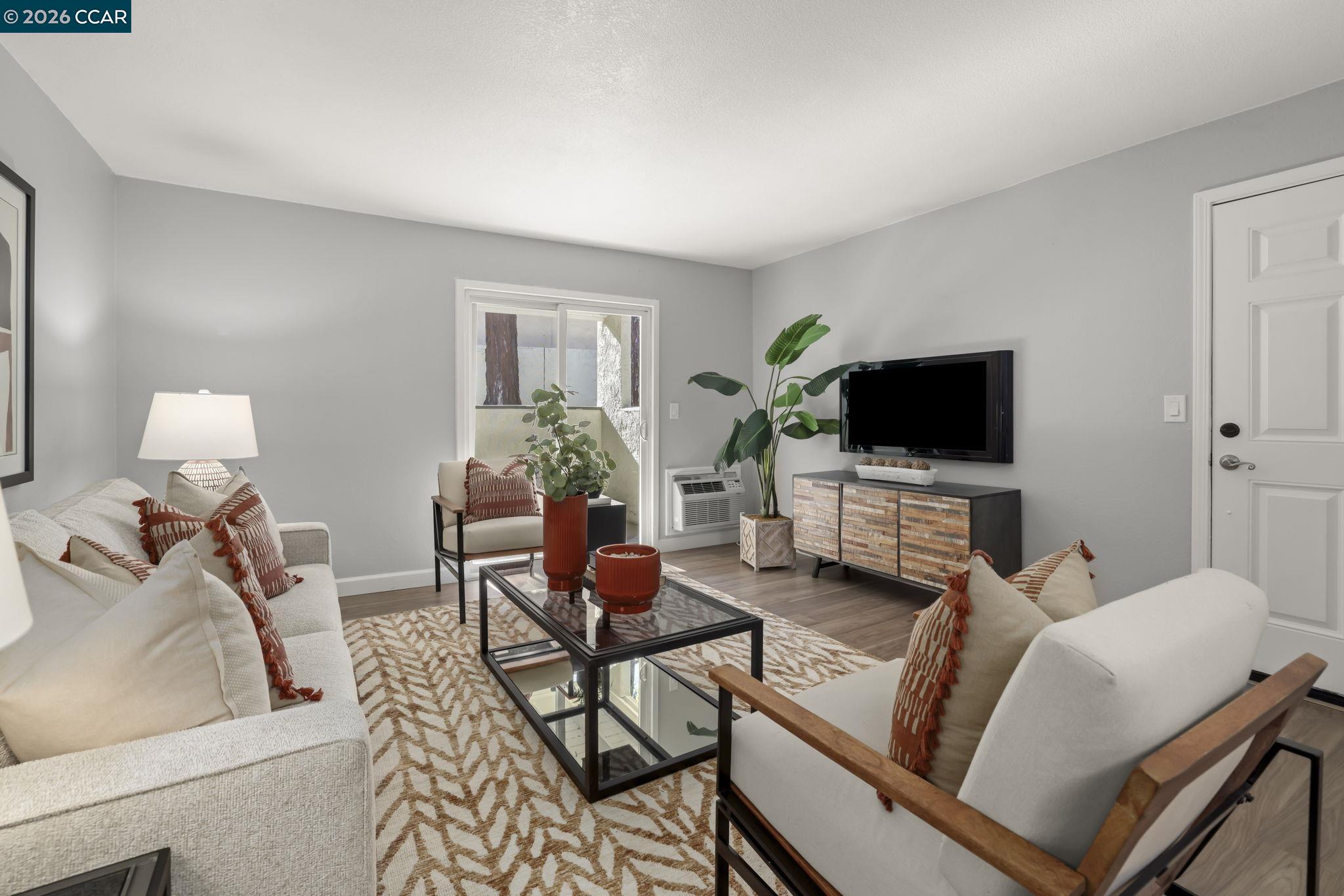 1505 Kirker Pass Road, Unit 164 Concord, CA 94521 - Photo 2 of 29 a living room with furniture and a flat screen tv