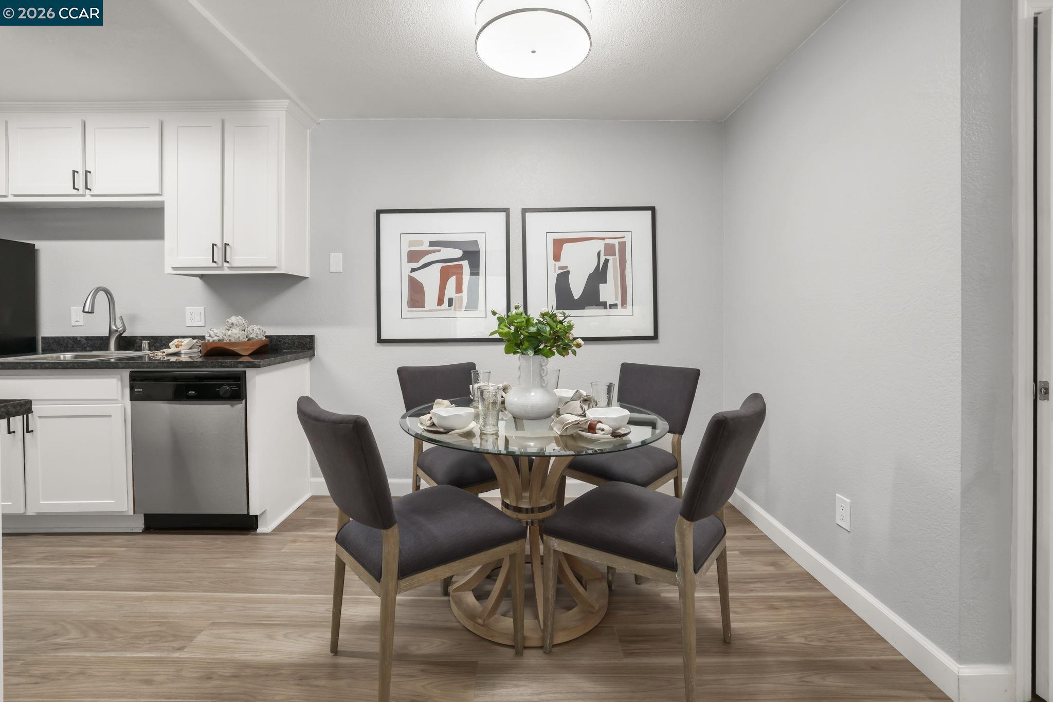 1505 Kirker Pass Road, Unit 164 Concord, CA 94521 - Photo 21 of 29 a dining room with furniture and wooden floor