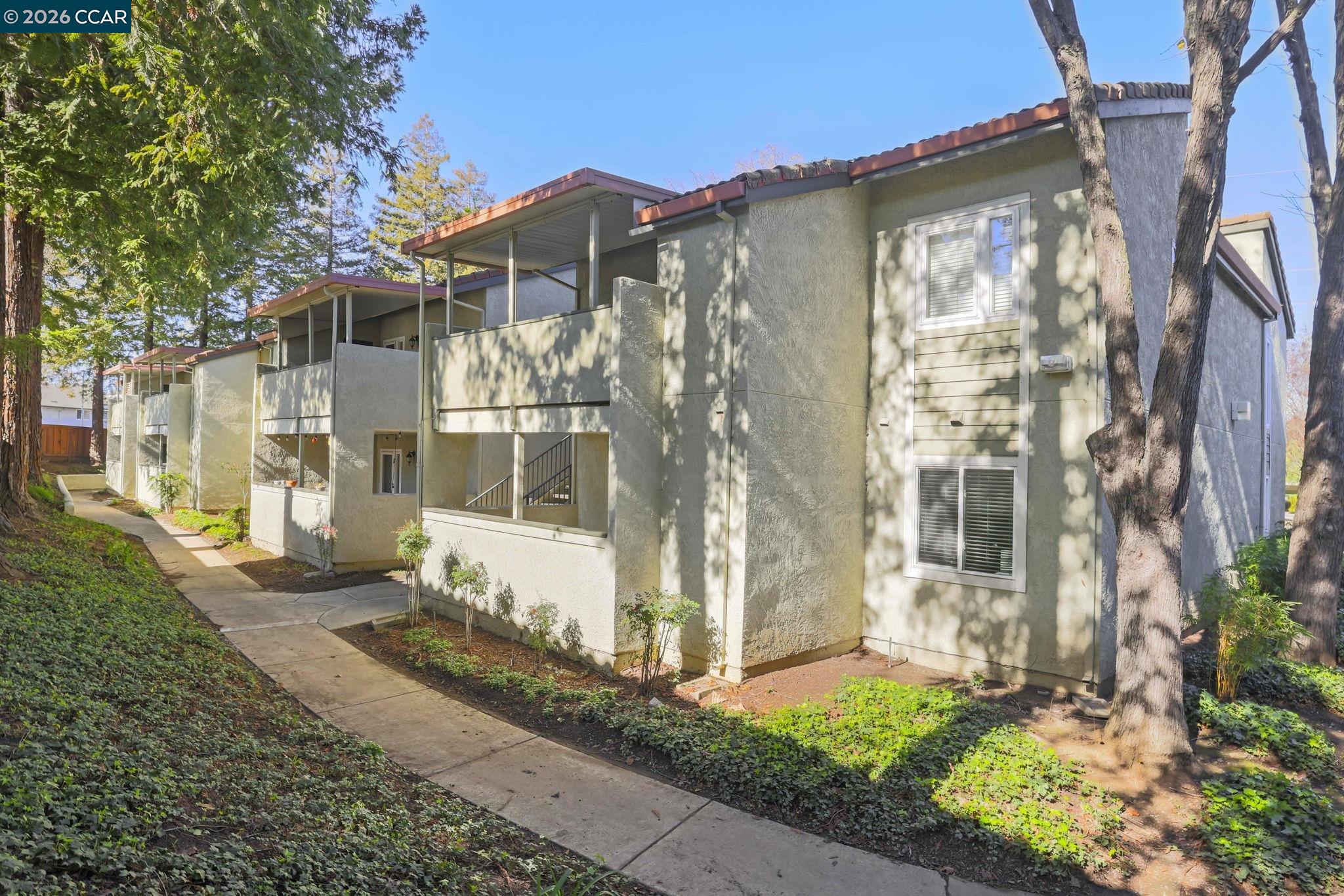 1505 Kirker Pass Road, Unit 164 Concord, CA 94521 - Photo 29 of 29 a front view of a house with a yard
